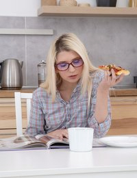 Beautiful blonde reads her magazine in the kitchen and enjoys a piece of pizza at the same time. She is about to take another pizza piece when her boyfriend enters the kitchen and tells her that she needs to pay him more attention. First hottie wants to return to that pizza piece but soon she surrenders to the dude and takes his cock into her mouth instead. Blondie gives dude a deep blowjob and then climbs on the kitchen table to get her pussy licked and penetrated. Finally, it is time to give another blowjob and to take a load of sperm into her wide-open mouth. Satisfied dude even rewards the hard-working blonde with her desired pizza piece.